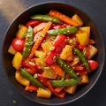 Sweet and Sour Vegetables with bell peppers and pineapple in glossy sauce